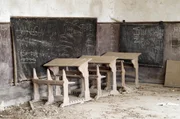 Abandoned desks in a old school