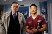 CHICAGO MED -- "Just A River In Egypt" Episode 519 -- Pictured: (l-r) Oliver Platt as Daniel Charles, Brian Tee as Ethan Choi