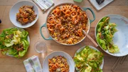 Beauty shot of Molly Yeh's Busy Day Hotdish and Pea & Bacon Salad with French Dressing, as seen on Girl Meets Farm, Season 7. Beauty shot of Molly Yeh's Busy Day Hotdish and Pea & Bacon Salad with French Dressing, as seen on Girl Meets Farm, Season 7.