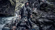 Wesley Richardson standing on the dredge, James Hamm on mountain side doing DIY.