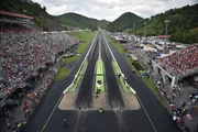 Wide shot of Bristol crowd from above the track . Wide shot of Bristol crowd from above the track .