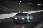 Ronnie Pace is guided back to the starting line after his burnout. Ronnie Pace is guided back to the starting line after his burnout.
