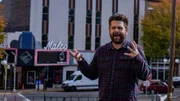 Jack Osbourne in front of the Malco Theatre marquee in Hot Springs, AR