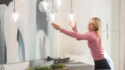 As seen on Hidden Potential, designer Jasmine Roth applies her finishing touch in the dining room of the newly renovated home of the McCoy family in Huntington Beach, California. Renovations include new flooring and a custom made dining table with storage. As seen on Hidden Potential, designer Jasmine Roth applies her finishing touch in the dining room of the newly renovated home of the McCoy family in Huntington Beach, California. Renovations include new flooring and a custom made dining table with storage.