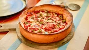 Beauty shot of Molly Yeh's Sausage, Peppers, Onion Deep Dish Pizza, as seen on Girl Meets Farm, Season 7. Beauty shot of Molly Yeh's Sausage, Peppers, Onion Deep Dish Pizza, as seen on Girl Meets Farm, Season 7.