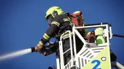 Several firefighting teams try to prevent the inferno from spreading to neighboring buildings with two turntable ladders. Several firefighting teams try to prevent the inferno from spreading to neighboring buildings with two turntable ladders.