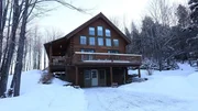 The exterior of the Woodland Cabin in Vermont, as seen on HGTV's Log Cabin Living The exterior of the Woodland Cabin in Vermont, as seen on HGTV's Log Cabin Living