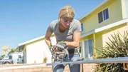 As seen on Hidden Potential, designer Jasmine Roth cuts wood trims that will bring a sophisticated mid-century look to the exterior of the otherwise bland suburban home of the the Pham family in Huntington Beach, CA. As seen on Hidden Potential, designer Jasmine Roth cuts wood trims that will bring a sophisticated mid-century look to the exterior of the otherwise bland suburban home of the the Pham family in Huntington Beach, CA.
