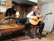 Jonathan Marshall plays the guitar for his Golden Eagle, Samson. Jonathan learnt how to pilot a microlight aircraft so he could fly alongside Samson. Jonathan Marshall plays the guitar for his Golden Eagle, Samson. Jonathan learnt how to pilot a microlight aircraft so he could fly alongside Samson.