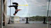 A parkour runner upside down while demonstrating walking on walls. Graphic arrows points out direction of feet. (Photo Credit: National Geographic Channels/Jukin) A parkour runner upside down while demonstrating walking on walls. Graphic arrows points out direction of feet. (Photo Credit: National Geographic Channels/Jukin)