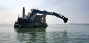 A shot of the Myrtle Irene in action as it digs for buried gold.