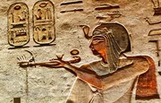 Wall relief of Ramesses III offering incense before seated god Ptah Sokar Osiris with Goddess Isis in the third corridor in the Tomb of Ramesses III,KV11, in the Valley of Kings,Luxor,Egypt