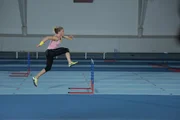 ESSEX, ENGLAND - Athlete Louis Wood shows how to obtain optimum trajectory when dealing with hurdles. ESSEX, ENGLAND - Athlete Louis Wood shows how to obtain optimum trajectory when dealing with hurdles.
