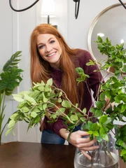 Host Jennifer Todryk stages the newly updated dining room of the Johnson home, as seen on No Demo Reno. (action)
