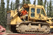 Fred Lewis jumping down from side of Komkatsu Dozer Fred Lewis jumping down from side of Komkatsu Dozer