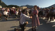 people celebrating in traditional Bavarian attire