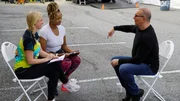 Chef Robert Irvine talks with Brandy Johns and Renesha Reynolds, owners of Moondoggy's Pizza, outside of the restaurant, as seen on Restaurant: Impossible, Season 20. Chef Robert Irvine talks with Brandy Johns and Renesha Reynolds, owners of Moondoggy's Pizza, outside of the restaurant, as seen on Restaurant: Impossible, Season 20.