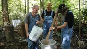 Eric "Digger" Manes, Mark Ramsey, and Jacob "JB" Rader making mash at the still site in the woods. Eric "Digger" Manes, Mark Ramsey, and Jacob "JB" Rader making mash at the still site in the woods.