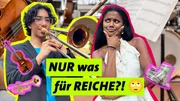 ARD/WDR POV – DEINE GESCHICHTE ZÄHLT, "Musik machen – Nur was für Reiche?", José (l.) spielt Posaune in einem Orchester in Dresden-Prohlis – der Unterricht ist kostenlos, damit alle im Viertel ein Instrument lernen können. Muss Musik ein Privileg sein? POV-Host Kiara (r.) begleitet José zum großen Orchester-Auftritt, auf den er monatelang hingearbeitet hat. ARD/WDR POV – DEINE GESCHICHTE ZÄHLT, "Musik machen – Nur was für Reiche?", José (l.) spielt Posaune in einem Orchester in Dresden-Prohlis – der Unterricht ist kostenlos, damit alle im Viertel ein Instrument lernen können. Muss Musik ein Privileg sein? POV-Host Kiara (r.) begleitet José zum großen Orchester-Auftritt, auf den er monatelang hingearbeitet hat.