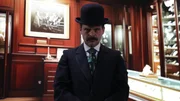 H.H. Holmes giving a meanacing look in fancy jewelry store