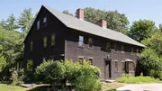 A before photo of the front exterior of the house, as seen on Farmhouse Fixer, Season 3.