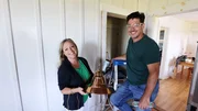 Jonathan Knight and Kristina Crestin in the living room during construction posing with a light fixture and tools, as seen on Farmhouse Fixer, Season 3. Jonathan Knight and Kristina Crestin in the living room during construction posing with a light fixture and tools, as seen on Farmhouse Fixer, Season 3.