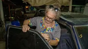 Heino inspects the rust spots on the Toyota. Heino inspects the rust spots on the Toyota.