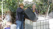 Mark Ramsey and Eric "Digger" Manes making mash at the still site in the woods..