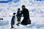Cameraman, David Reichert filming the Emperor Penguins march to the ice edge at the Cape Washington Emperor Penguin colony. (National Geographic/Tanja Bayer) Cameraman, David Reichert filming the Emperor Penguins march to the ice edge at the Cape Washington Emperor Penguin colony. (National Geographic/Tanja Bayer)