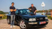 Mike standing on right of Audi RS2, Elvis standing on left of Audi RS2, both with arms resting on car smiling looking into stills camera,, lake in background Mike standing on right of Audi RS2, Elvis standing on left of Audi RS2, both with arms resting on car smiling looking into stills camera,, lake in background