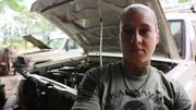 Kinessa helping repair the vehicle in Tanzania. Kinessa helping repair the vehicle in Tanzania.