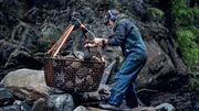 Paul Richardson holding loaded rock basket. Paul Richardson holding loaded rock basket.