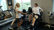 Zsaylnn working out with a personal trainer. Zsaylnn working out with a personal trainer.