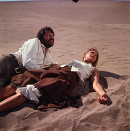 Frank Calder (Oliver Reed, l.); Melissa Ruger (Candice Bergen, r.)