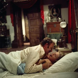 Brandt Ruger (Gene Hackman, l.); Melissa Ruger (Candice Bergen, r.)