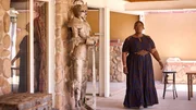 Retta reacts to suit of armor statue at Anchor home, as seen on Ugliest House in America, Season 7.