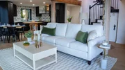 After, the living room, as seen on Ugliest House in America Season 7.
