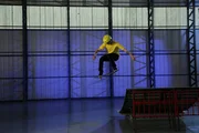 ESSEX, ENGLAND – Stephen Melia jumps off a ramp on to the floor on a skateboard showing good center of mass. ESSEX, ENGLAND – Stephen Melia jumps off a ramp on to the floor on a skateboard showing good center of mass.