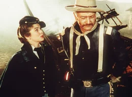 Olivia Dandridge (Joanne Dru), Capt. Nathan Cutting Brittles (John Wayne)