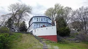 Exterior of the Broken Boat by the Lake home, as seen on Ugliest House In America, Season 6.