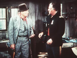 L-R: Top Sgt. Quincannon (Victor McLaglen), Capt. Nathan Cutting Brittles (John Wayne)