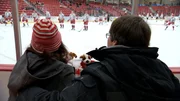 Joe and Sarah takes in a hockey game.