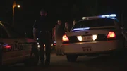 Demery talks with women at the crime scene. Demery talks with women at the crime scene.