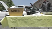 The evidence box is in front of a car. The evidence box is in front of a car.