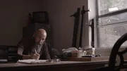 Bearded man sits with smoke in the air. Bearded man sits with smoke in the air.