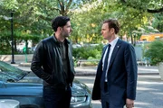 Tom Ellis as CIA Case Officer Colin Glass and Nick Gehlfuss as Special Agent Bill Goodman.