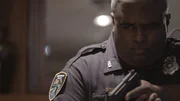 A cop points a gun. A cop points a gun.