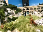 A small detail within the miniature wonderland, a model of a painter while painting. A small detail within the miniature wonderland, a model of a painter while painting.