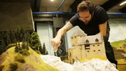 Martin Tsch&ouml;ke and his son Paul are working on an all-terrain truck.
