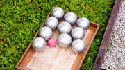 Petanque Metal Balls ready for Playing on Grass. Selective focus. Petanque Metal Balls ready for Playing on Grass. Selective focus.